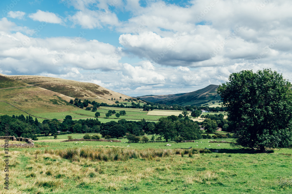 Naklejka premium Beautiful field view on Edale village and Mam Tor at Peak District National Park, England, UK. Staycation concept of traveling local
