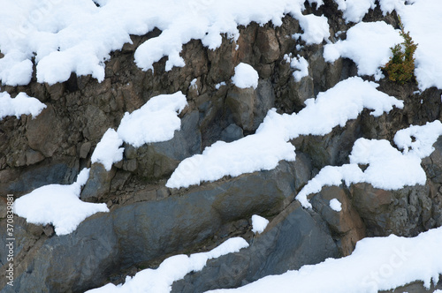 Rock wall covered with snow in Sabiñanigo. Huesca. Aragon. Spain. photo