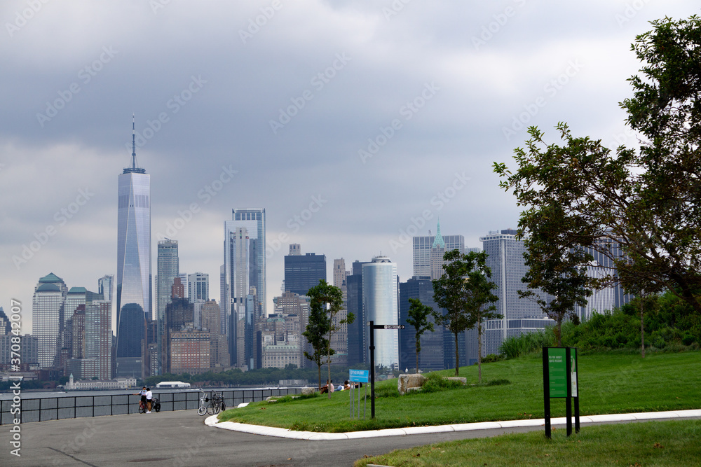 Aerial view of downtown Manhattan seen from Governors Island on a cloudy day. Aerial view of downtown Manhattan seen from Governors Island on a cloudy day.