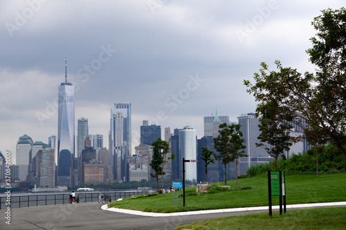 Aerial view of downtown Manhattan seen from Governors Island on a cloudy day.