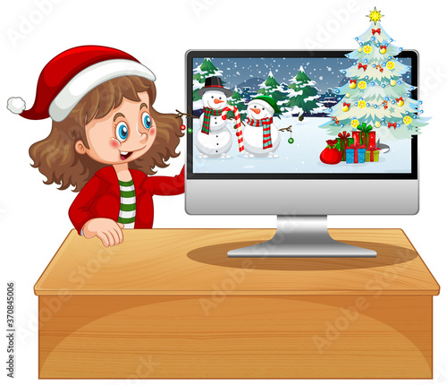 Girl next to computer with xmas theme