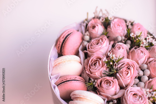 Gift box with pink roses and sweet french dessert macaroons for Valentine s Day gift