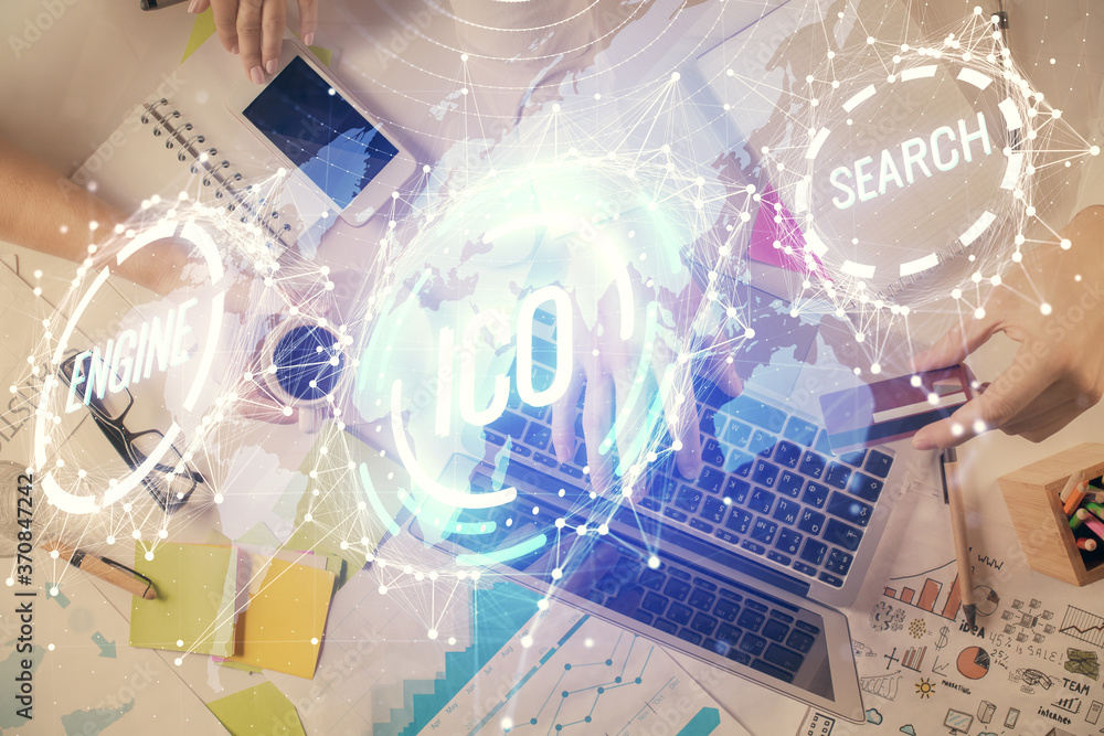 Double exposure of man's hands typing over computer keyboard and crypto currency theme hologram drawing. Top view. Blockchain concept. Double exposure of man's hands typing over computer keyboard and crypto currency theme hologram drawing. Top view. Blockchain concept.