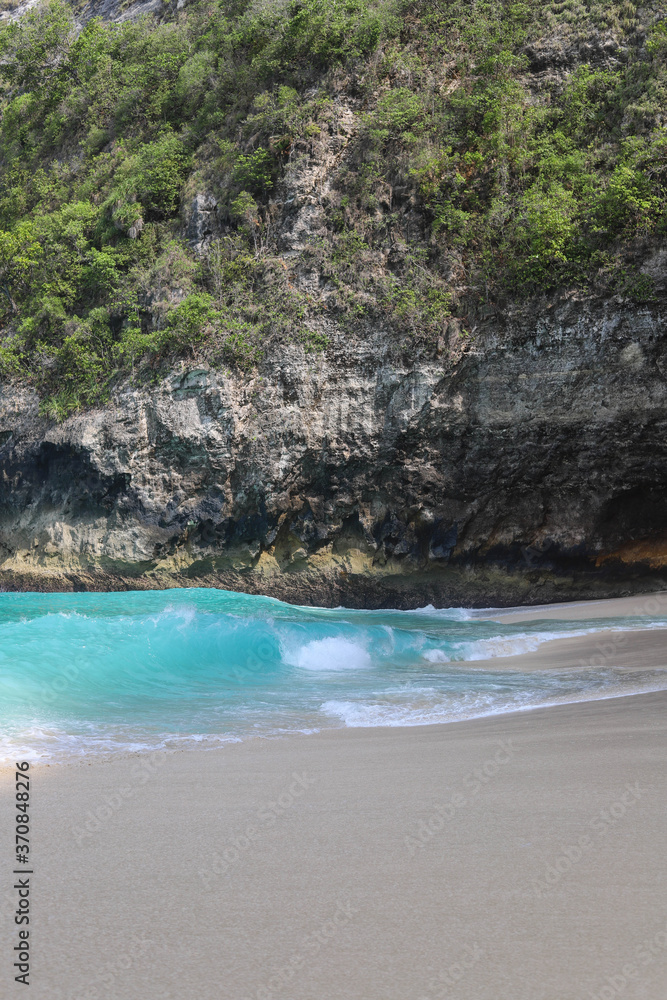 Manta Bay or Kelingking Beach on Nusa Penida Island, Bali, Indonesia. Amazing view, white sand beach with rocky mountains and azure lagoon with clear water of Indian Ocean Manta Bay or Kelingking Beach on Nusa Penida Island, Bali, Indonesia. Amazing view, white sand beach with rocky mountains and azure lagoon with clear water of Indian Ocean