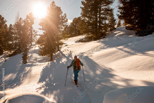 Austria, Carinthia, Reichenau, Nockberge, Falkert, Rear view of man ski touring at sunset