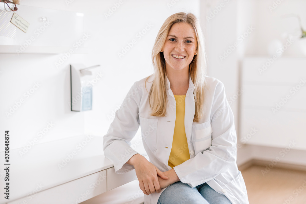 Portrait of smiling female doctor in medical practice Portrait of smiling female doctor in medical practice