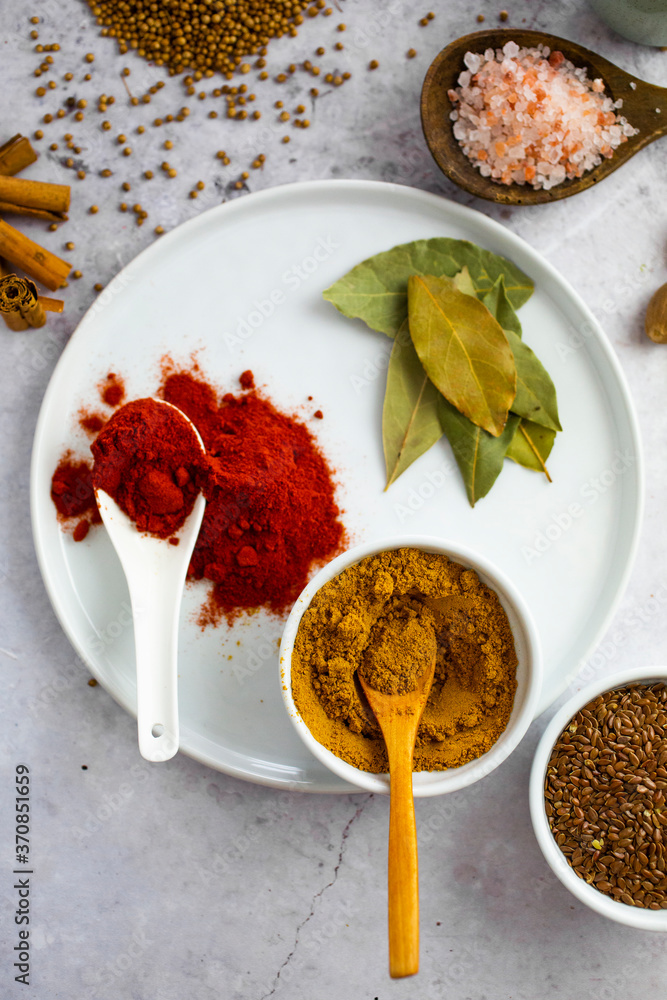 Paprika, curry powder, pink salt and coriander seeds, and Bay leaves