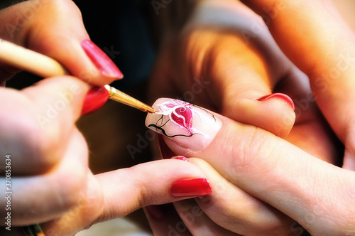 Manicure. Drawing a picture on a nail