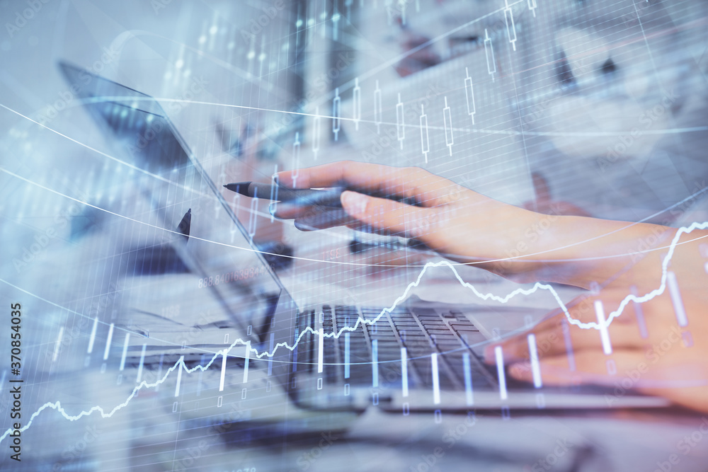 Multi exposure of woman hands typing on computer and financial graph hologram drawing. Stock market analysis concept. Multi exposure of woman hands typing on computer and financial graph hologram drawing. Stock market analysis concept.