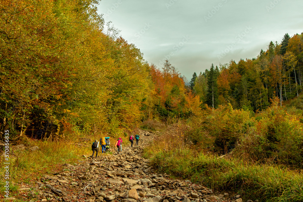 Obraz premium group of people hiking mountain autumn picturesque landscape nature environment space in September season