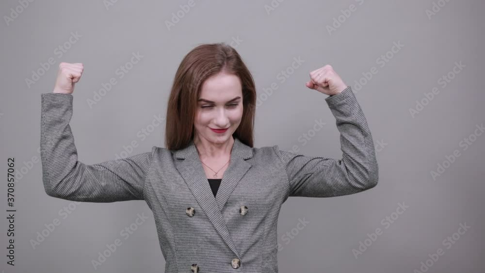Feels proud have strength, shows great power, raises arms to show muscles confident in victory, looks strong and independent, flexing arm, facial expressions, feelings, attitude, life perception Feels proud have strength, shows great power, raises arms to show muscles confident in victory, looks strong and independent, flexing arm, facial expressions, feelings, attitude, life perception