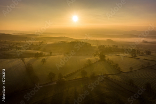 Wallpaper Mural Sunrise over farmland near the Yorkshire Dales village of Eshton a small village and civil parish in the Craven district of North Yorkshire, England. At the 2011 Census the population was less than 100 and is included in the civil parish of Flasby with Winterburn. In 2015, North Yorkshire County Council estimated the population to be 70 Torontodigital.ca