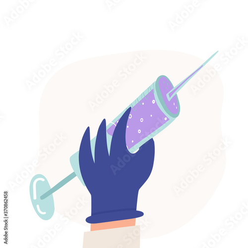 The hand of a scientist, biologist or medic holding a syringe with a vaccine.Defeating the corona virus pandemic concept
