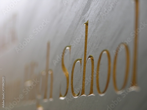 Wallpaper Mural Close-up of high school sign with gold lettering Torontodigital.ca