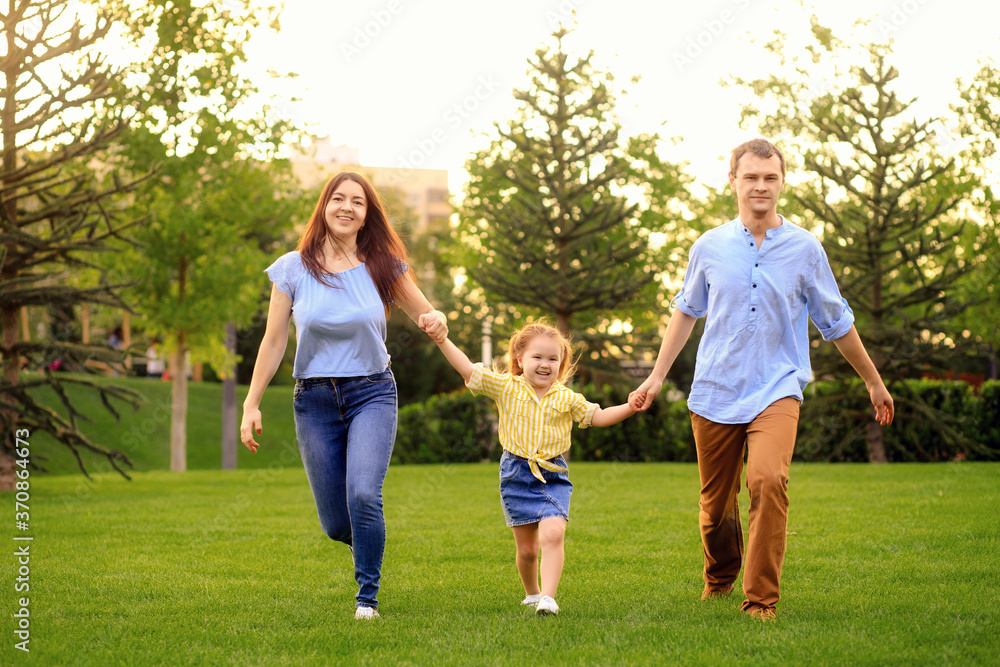 Happy family walk in the park in summer Happy family walk in the park in summer