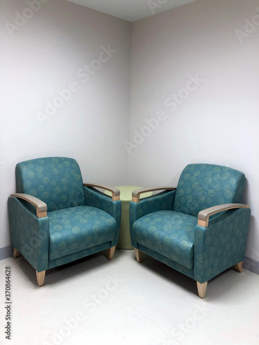 Wallpaper Mural Two patterned lounge chairs placed in corner of hospital facility Torontodigital.ca