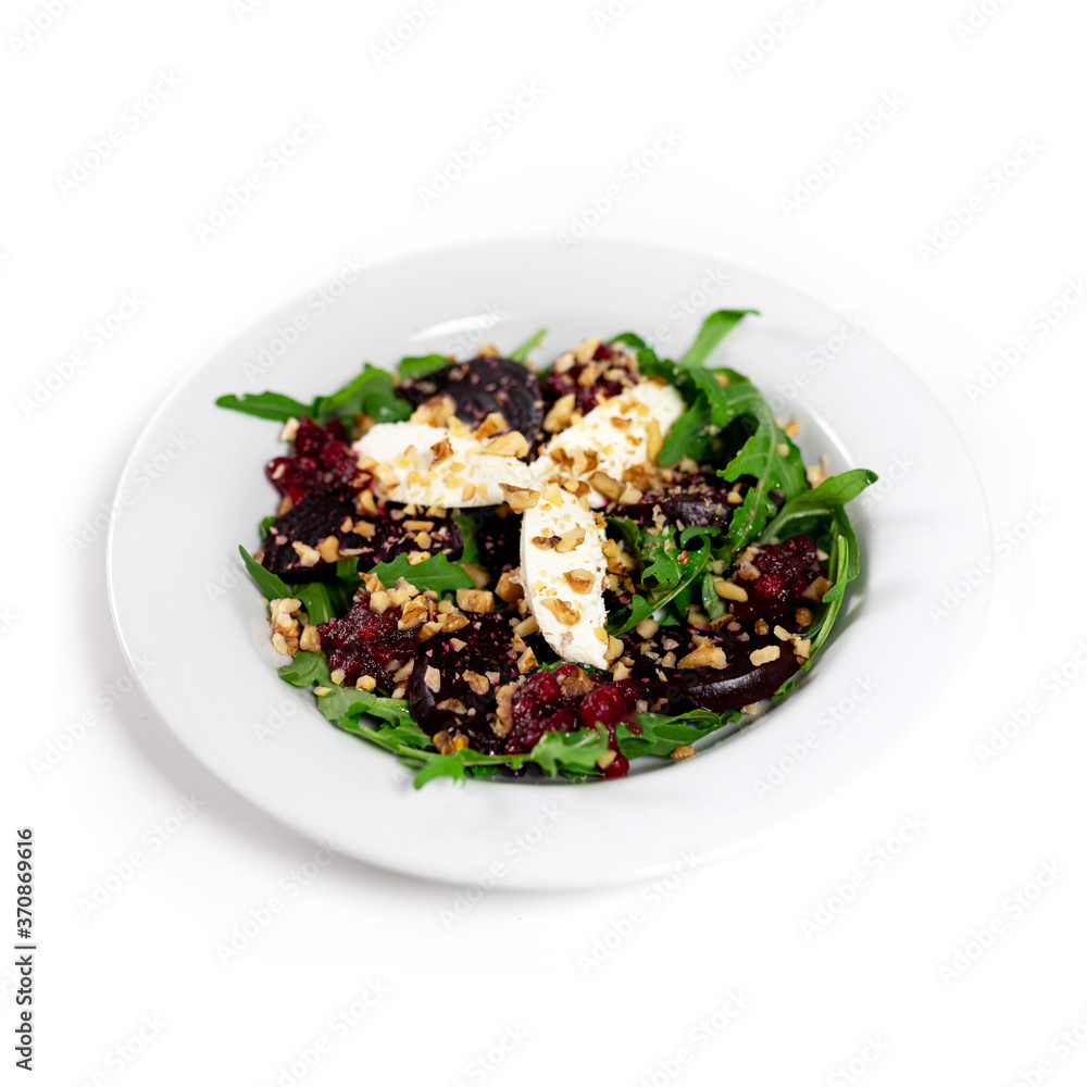Salad with vegetables and cheese, nuts and arugula. White background Salad with vegetables and cheese, nuts and arugula. White background