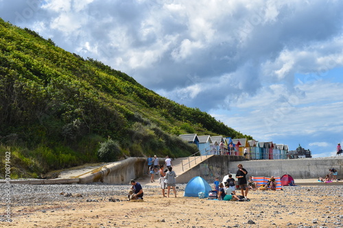 Beach huts chalet or coastal hut site available for weekly lettings in north Norfolk’s resorts Beachgoers flock to the British seaside escaping the heatwave equipped with tents windbreaks rubber rings