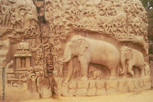Mahabalipuram, India. Rock cut art of ancient India.large elephant and religious characters carved on a single stone.