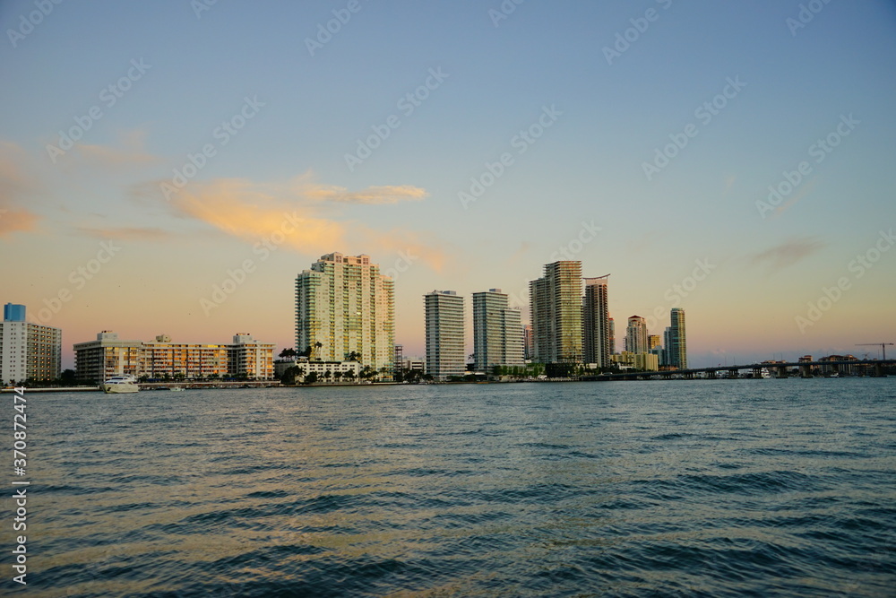 Miami downtown skyscrapers and beach at sun set	
