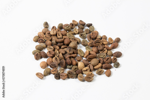 Organic green coffee beans isolated on white background close up. Top view. Flat lay