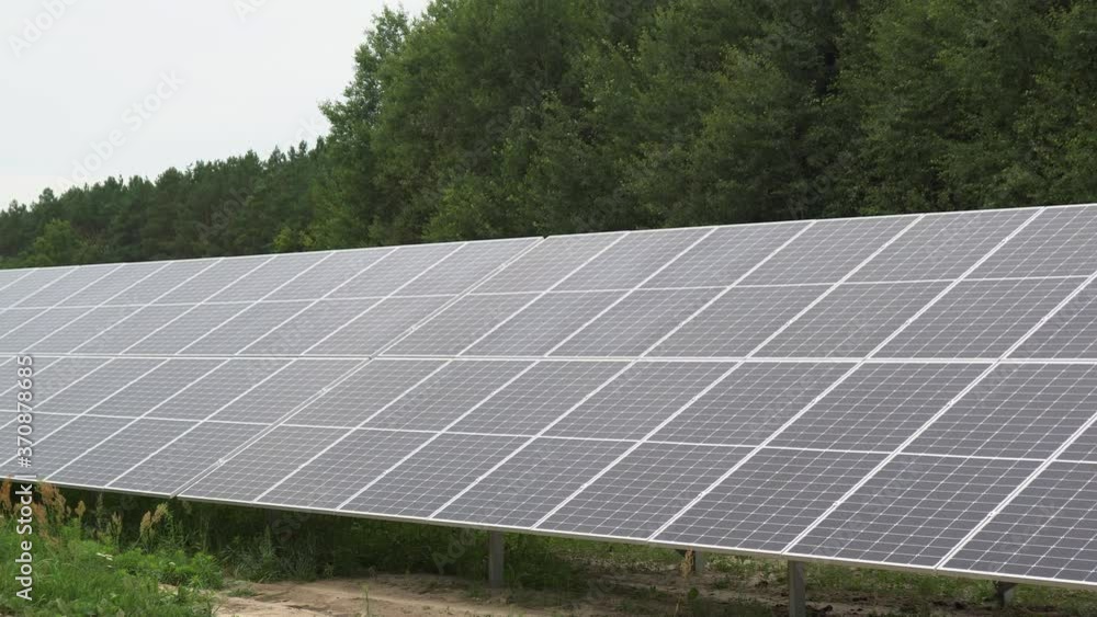 A solar panel station installed in a field to collect solar energy and convert it into electricity. Environmentally friendly electrical energy. A solar panel station installed in a field to collect solar energy and convert it into electricity. Environmentally friendly electrical energy.