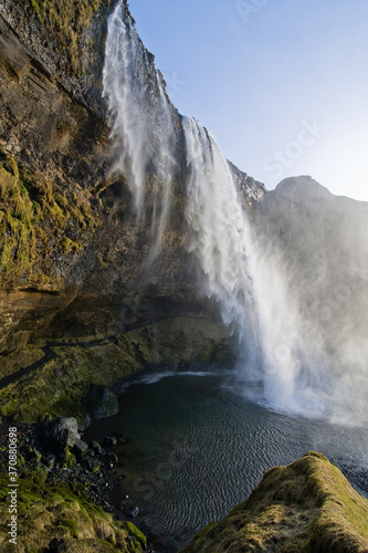 waterfall into lake in Iceland