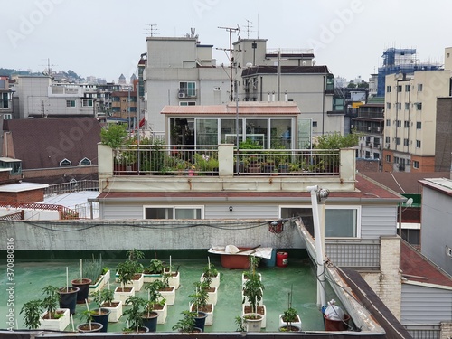 Arial view of old Seoul houses. Packed houses in south Korea and roof top garden view.
