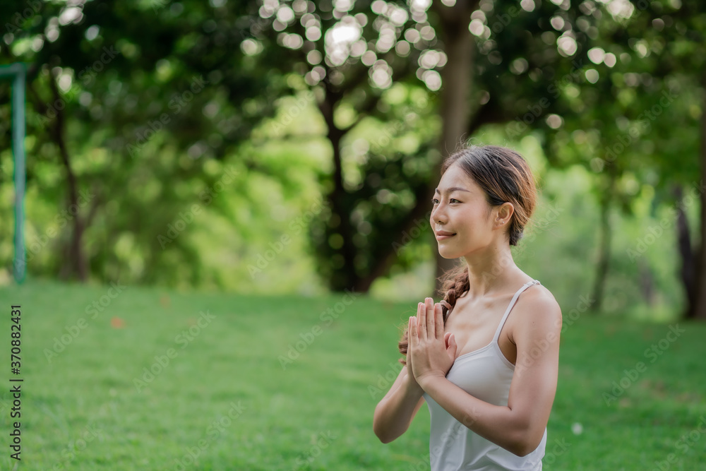 Healthy women doing yoga in the moring at the park . concept healthy and outdoor activity. Healthy women doing yoga in the moring at the park . concept healthy and outdoor activity.