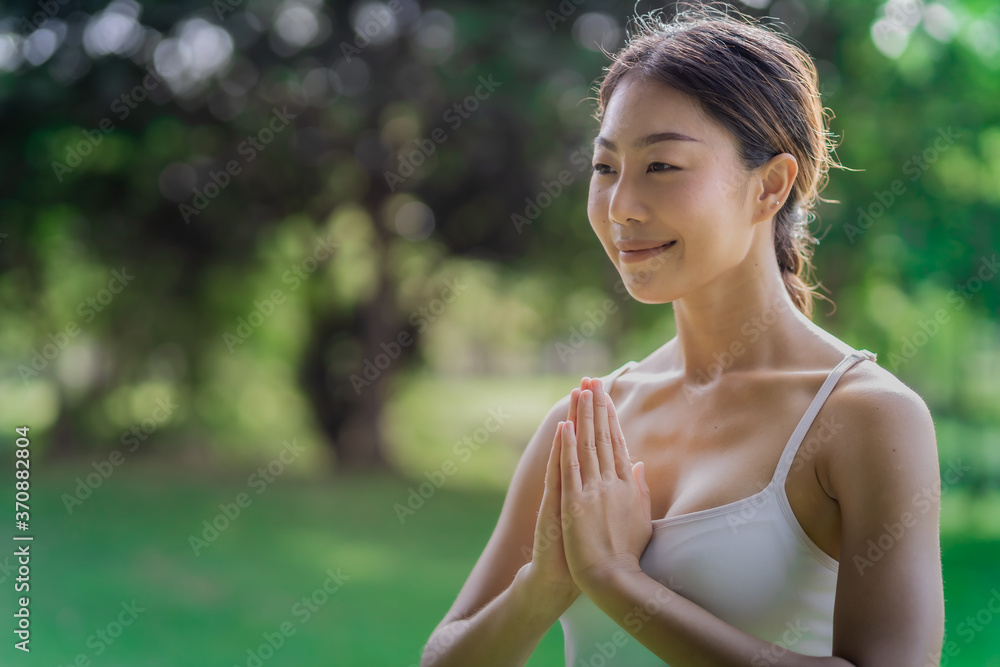 Healthy women doing yoga in the moring at the park . concept healthy and outdoor activity. Healthy women doing yoga in the moring at the park . concept healthy and outdoor activity.