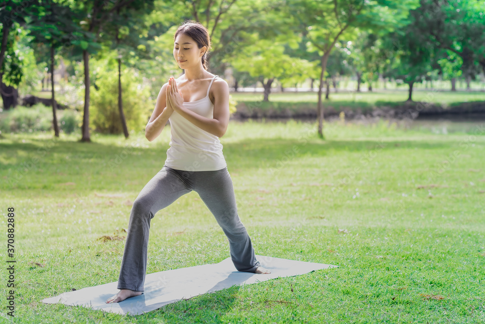 Healthy women doing yoga in the moring at the park . concept healthy and outdoor activity. Healthy women doing yoga in the moring at the park . concept healthy and outdoor activity.