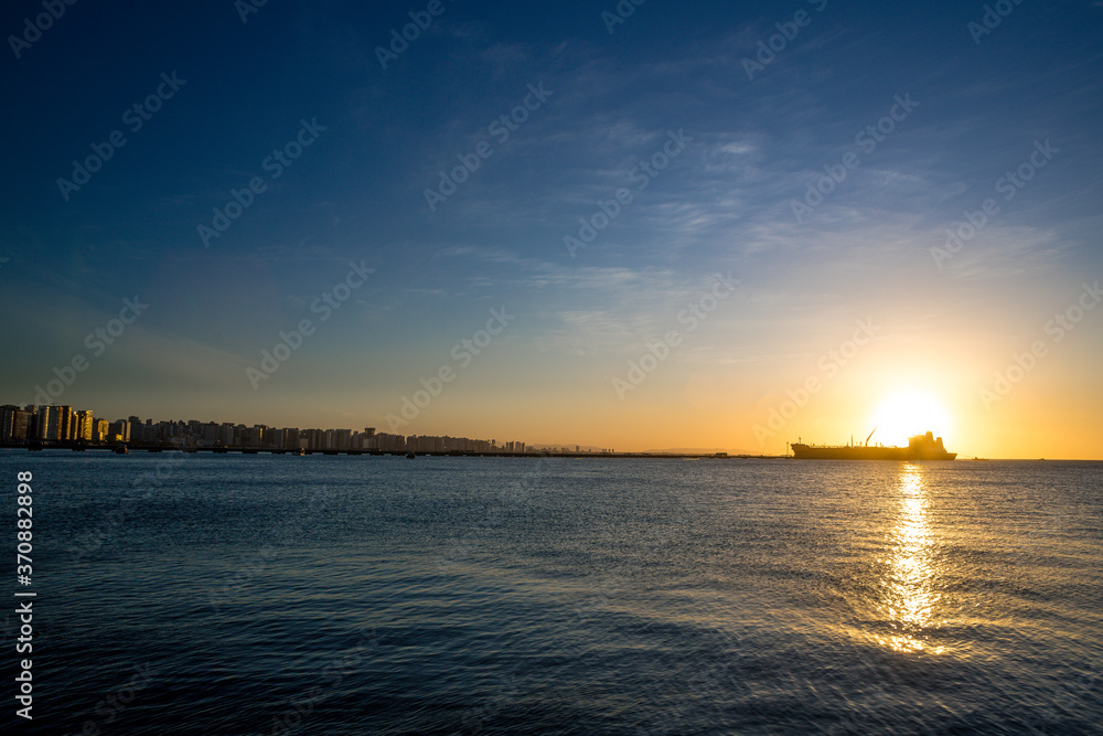 Naklejka premium sunset over the harbor