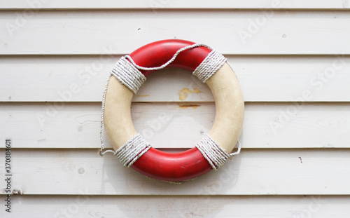 Decorative life preserver on rustic weather board wall