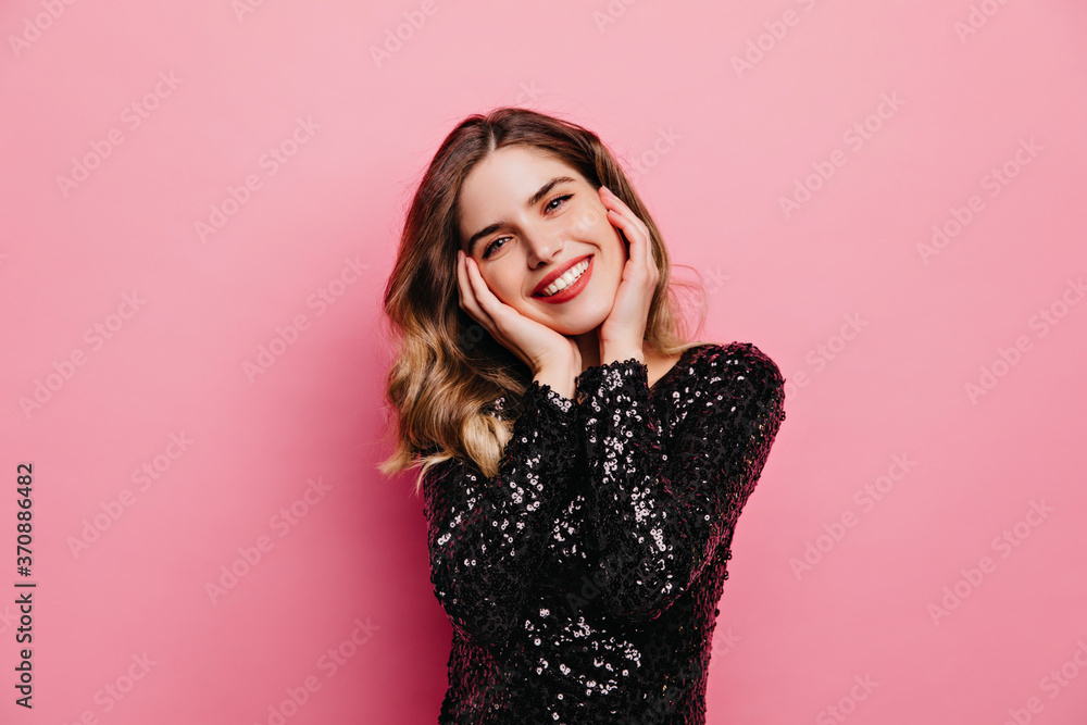 Pleased good-looking woman posing with sincere smile. Indoor portrait of cute european girl isolated on pink background. Pleased good-looking woman posing with sincere smile. Indoor portrait of cute european girl isolated on pink background.