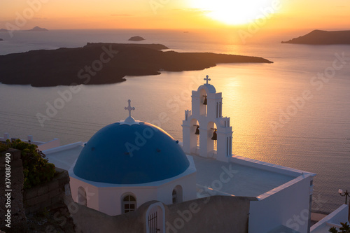 Classic view of gerasimos christian church sunset with volcano island in the background