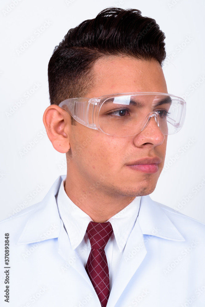 Young handsome multi ethnic man doctor as scientist wearing protective glasses Young handsome multi ethnic man doctor as scientist wearing protective glasses