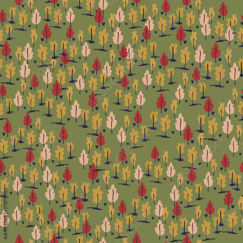 Little forest ornament seamless hand drawn pattern. Autumn palette stylized artwork with trees on green background.