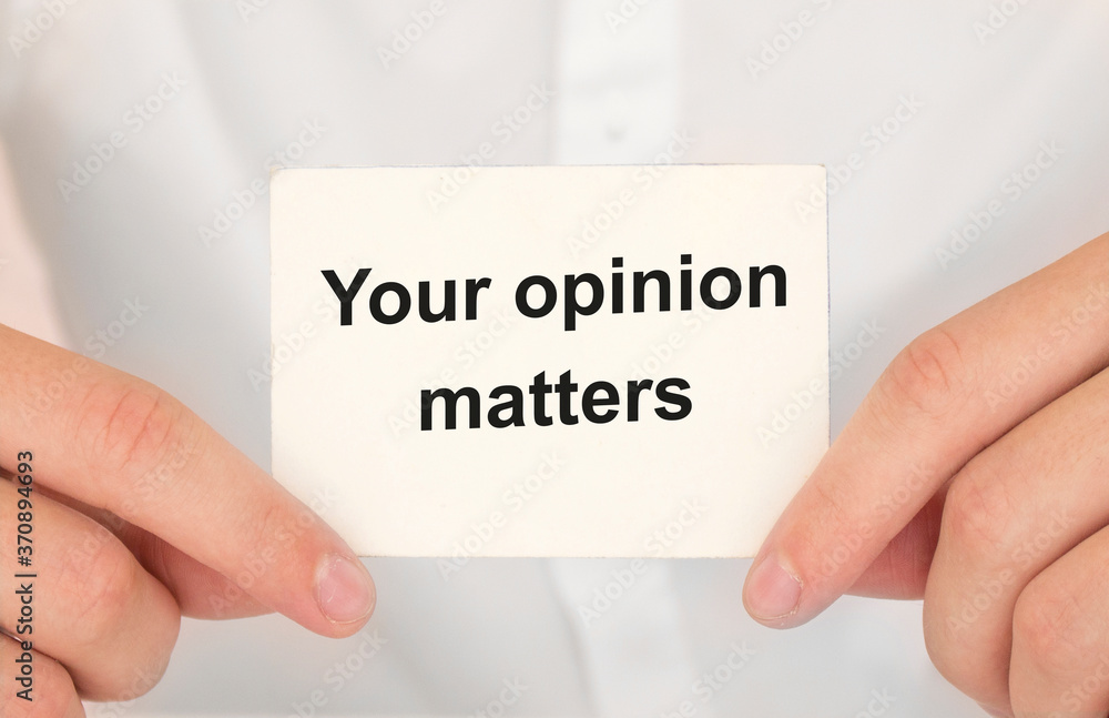 Man's hands take a card with words Your opinion matters, finance and business concept. Man's hands take a card with words Your opinion matters, finance and business concept.