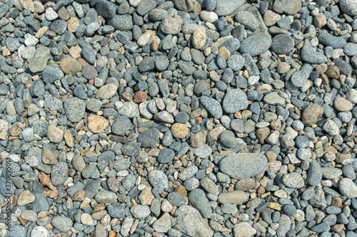 Background. Polished marine gray pebbles