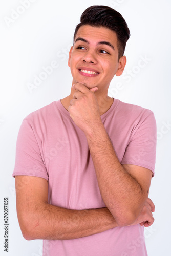 Portrait of happy young handsome multi ethnic man