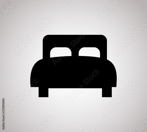 Bed with pillows simple black vector icon. Hotel or hostel symbol.