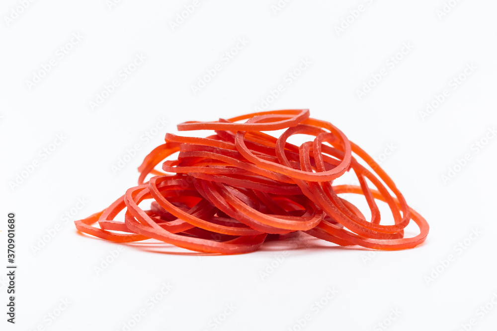 Red rubber bands on white background. Isolated rubber band. Pile of rubber bands.