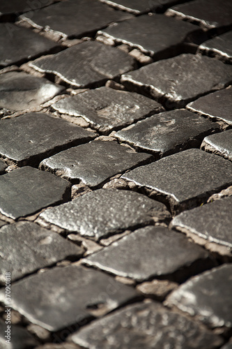 Cobblestones pave many of the streets of Rome, some dating all the way back to the Roman Empire.
