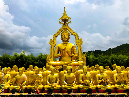 Many monks' statues and Buddha make prayers in Makha Bucha Buddhist Memorial Park,Thailand