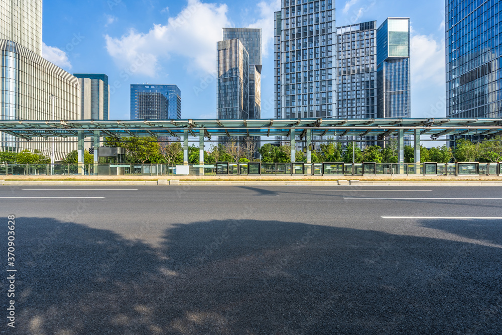 cityscape and skyline of nanjing from empty asphalt road cityscape and skyline of nanjing from empty asphalt road