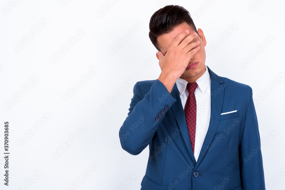 Portrait of young handsome multi ethnic businessman in suit Portrait of young handsome multi ethnic businessman in suit