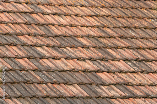 Background of old roof tiles, brown clay roof tiles