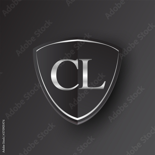 Initial logo letter CL with shield Icon silver color isolated on black background, logotype design for company identity.