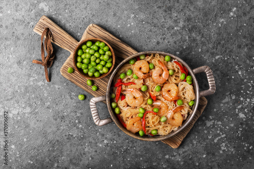 A traditional dish of Asian cuisine. Rice vermicelli with shrimps and green peas