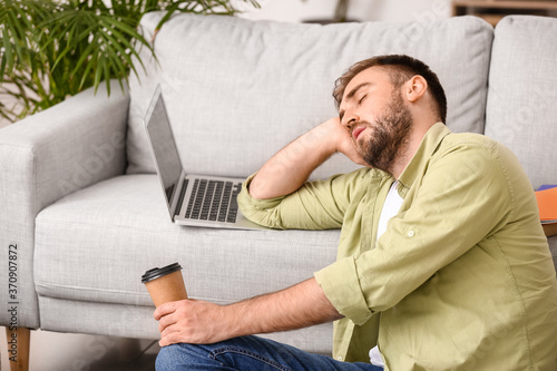 Tired male student sleeping...